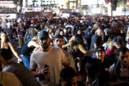 LAS VEGAS, NV - OCTOBER 01:  People flee the Route 91 Harvest country music festival grounds after a active shooter was reported on October 1, 2017 in Las Vegas, Nevada. A gunman has opened fire on a music festival in Las Vegas, leaving at least 2 people dead. Police have confirmed that one suspect has been shot. The investigation is ongoing. (Photo by David Becker/Getty Images)