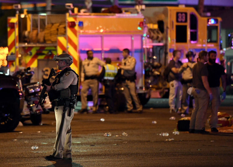 LAS VEGAS, NV - OCTOBER 02:  A Las Vegas Metropolitan Police Department officer stands in the intersection of Las Vegas Boulevard and Tropicana Ave. after a mass shooting at a country music festival nearby on October 2, 2017 in Las Vegas, Nevada. A gunman has opened fire on a music festival in Las Vegas, leaving at least 20 people dead and more than 100 injured. Police have confirmed that one suspect has been shot. The investigation is ongoing. (Photo by Ethan Miller/Getty Images)