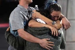 LAS VEGAS, NV - OCTOBER 02:  People hug and cry outside the Thomas &amp; Mack Center after a mass shooting at the Route 91 Harvest country music festival on October 2, 2017 in Las Vegas, Nevada. A gunman, identified as Stephen Paddock, 64, of Mesquite, Nevada, opened fire from the Mandalay Bay Resort and Casino on the music festival, leaving at least 50 people dead and hundreds injured. Police have confirmed that one suspect has been shot. The investigation is ongoing.  (Photo by Ethan Miller/Getty Images)