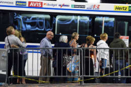 LAS VEGAS, NV - OCTOBER 02:  People wait to get on a McCarran International Airport rental car bus outside the Thomas &amp; Mack Center after a mass shooting at a country music festival on October 2, 2017 in Las Vegas, Nevada. People who could not go to hotel-casinos that were closed after the shooting are temporarily staying at the center. The gunman, identified as Stephen Paddock, 64, of Mesquite, Nevada, opened fire from the Mandalay Bay Resort and Casino on the music festival, leaving at least 50 people dead and hundreds injured. Police have confirmed that one suspect has been shot. The investigation is ongoing.  (Photo by Ethan Miller/Getty Images)