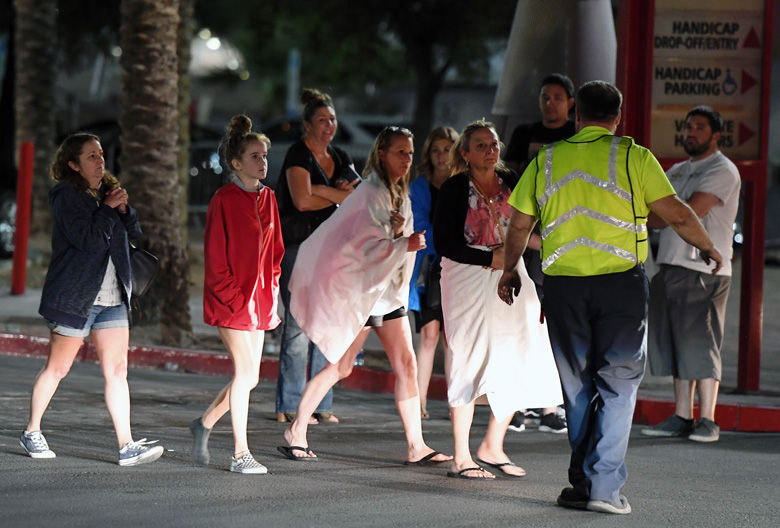 LAS VEGAS, NV - OCTOBER 02:  People are directed to rides outside the Thomas &amp; Mack Center after a mass shooting at a country music festival on October 2, 2017 in Las Vegas, Nevada. People who could not go to hotel-casinos that were closed after the shooting are temporarily staying at the center. The gunman, identified as Stephen Paddock, 64, of Mesquite, Nevada, opened fire from the Mandalay Bay Resort and Casino on the music festival, leaving at least 50 people dead and hundreds injured. Police have confirmed that one suspect has been shot. The investigation is ongoing.  (Photo by Ethan Miller/Getty Images)