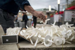 NASHVILLE, TN - OCTOBER 02: People hand out candles at the Ascend Amphitheater for a vigil honoring the victims of the mass shooting in Las Vegas on October 2, 2017 in Nashville, Tennessee. At least 58 people were killed and 500 wounded at the Route 91 Harvest Festival in Las Vegas Sunday night. (Photo by Joe Buglewicz/Getty Images)