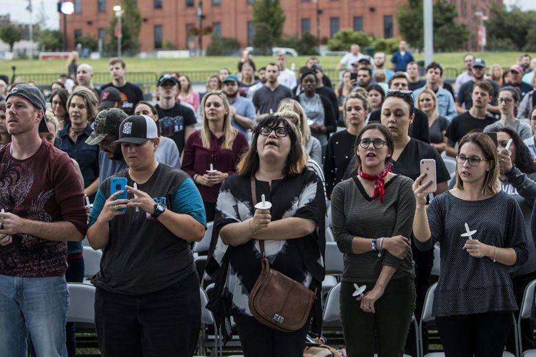 NASHVILLE, TN - OCTOBER 02: People gather at the Ascend Amphitheater for a vigil honoring the victims of the mass shooting in Las Vegas on October 2, 2017 in Nashville, Tennessee. At least 58 people were killed and 500 wounded at the Route 91 Harvest Festival in Las Vegas Sunday night. (Photo by Joe Buglewicz/Getty Images)