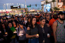 LAS VEGAS, NV - OCTOBER 2: Mourners attend a candlelight vigil at the corner of Sahara Avenue and Las Vegas Boulevard for the victims of Sunday night's mass shooting, October 2, 2017 in Las Vegas, Nevada. Late Sunday night, a lone gunman killed more than 50 people and injured more than 500 people after he opened fire on a large crowd at the Route 91 Harvest Festival, a three-day country music festival. The massacre is one of the deadliest mass shooting events in U.S. history. (Photo by Drew Angerer/Getty Images)