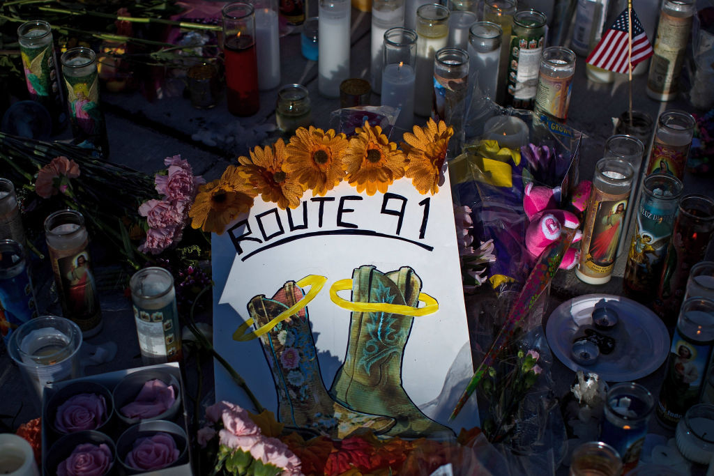 LAS VEGAS, NV - OCTOBER 3: A makeshift memorial for the victims of Sunday night's mass shooting stands at an intersection on the north end of the Las Vegas Strip, October 3, 2017 in Las Vegas, Nevada. The gunman, identified as Stephen Paddock, 64, of Mesquite, Nevada, allegedly opened fire from a room on the 32nd floor of the Mandalay Bay Resort and Casino on the music festival, leaving at least 58 people dead and over 500 injured. According to reports, Paddock killed himself at the scene. The massacre is one of the deadliest mass shooting events in U.S. history. (Photo by Drew Angerer/Getty Images)