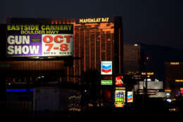 LAS VEGAS, NV - OCTOBER 3: With the Mandalay Bay Resort and Casino in the background, a billboard advertising an upcoming gun show is seen along the Las Vegas Strip, October 3, 2017 in Las Vegas, Nevada. Late Sunday night, a lone gunman killed over 50 people and injured over 500 people after he opened fire on a large crowd at the Route 91 Harvest Festival, a three-day country music festival. The massacre is one of the deadliest mass shooting events in U.S. history. (Photo by Drew Angerer/Getty Images)