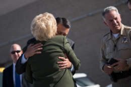 LAS VEGAS, NV - OCTOBER 4: Las Vegas Mayor Carolyn Goodman hugs Nevada Governor Brian Sandoval as Clark County Sheriff Joe Lombardo looks on, ahead of  President Donald Trump's arrival at McCarran International Airport, October 4, 2017 in Las Vegas, Nevada. Trump is scheduled to visit with victims  and first responders from Sunday night's mass shooting during his trip to Las Vegas. (Photo by Drew Angerer/Getty Images)
