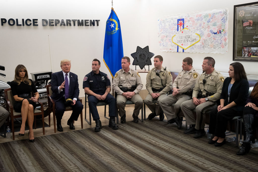 LAS VEGAS, NV - OCTOBER 4: (L to R) First lady Melania Trump and President Donald Trump meet with police officers at Las Vegas Metropolitan Police Department headquarters, October 4, 2017 in Las Vegas, Nevada. Trump is scheduled to visit with victims and first responders from Sunday night's mass shooting during his trip to Las Vegas. (Photo by Drew Angerer/Getty Images)