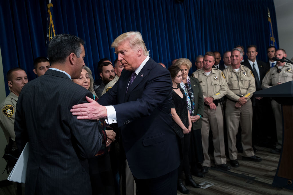 LAS VEGAS, NV - OCTOBER 4: President Donald Trump shakes hands with Nevada Governor Brian Sandoval after speaking in a room full of police officers and family members at Las Vegas Metropolitan Police Department headquarters, October 4, 2017 in Las Vegas, Nevada. Trump is scheduled to visit with victims  and first responders from Sunday night's mass shooting during his trip to Las Vegas. (Photo by Drew Angerer/Getty Images)