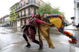 NEW ORLEANS, LA - OCTOBER 07:  A woman dances in the street in the French Quarter before Hurricane Nate makes landfall on October 7, 2017 in New Orleans, Louisiana.  Nate is expected to make landfall as a category 2 hurrincane near Biloxi, Mississippi later this evening.  (Photo by Sean Gardner/Getty Images)