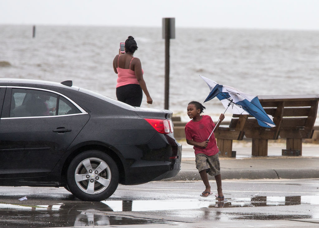 GULFPORT,MS-OCTOBER 7, 2017:  A family takes photos of the Gulf of Mexico in Gulfport, Mississippi as Hurricane Nate approaches the northern Mississippi Gulf Coast on October 7, 2017 in Gulfport, Mississippi.  Nate is expected to make landfall in the overnight hours as a category 2 storm.   (Photo by Mark Wallheiser/Getty Images)