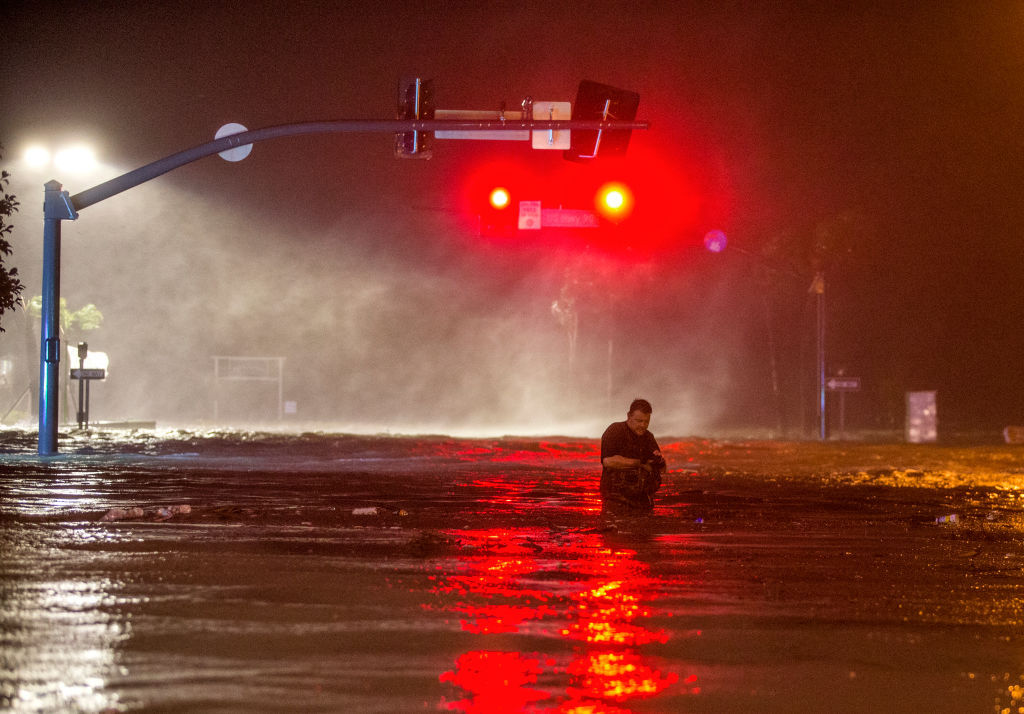 BILOXI,MS-OCTOBER 8, 2017: Lanny Dean, from Tulsa, Oklahoma, takes video as he wades along a flooded Beach Boulevard next to Harrahs Casino as the eye of Hurricane Nate pushes ashore in Biloxi, Mississippi October 8, 2017. Hurricane Nate flooded the parking garage and first floors of Golden Nugget, Harrahs and other casinos as it made a second landfall on the Mississippi coast as a category 1 storm. (Photo by Mark Wallheiser/Getty Images)