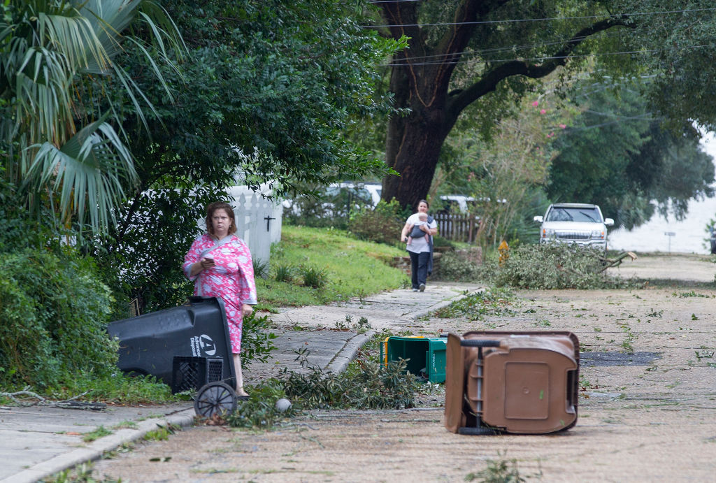 BILOXI, MS - OCTOBER 8:  Biloxi residents venture out just after dawn to survey the damage after the eye of Hurricane Nate made its second landfall on October 8, 2017 in Biloxi, Mississippi. Hurricane Nate came ashore on the north Mississippi Gulf Coast as a category 1 hurricane Sunday before weakening to a tropical storm.  (Photo by Mark Wallheiser/Getty Images)