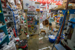 BAYOU LA BATRE, AL - OCTOBER 8:  Tara Marshall cleans up Marshall Marine after the store took three feet of storm surge from Hurricane Nate on October 8, 2017 in Bayou La Batre, Alabama.  Hurricane Nate made its second landfall along the north Mississippi Gulf Coast as a category 1 hurricane Sunday before weakening to a tropical storm.  (Photo by Mark Wallheiser/Getty Images)