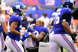 EAST RUTHERFORD, NJ - OCTOBER 08: Odell Beckham #13 of the New York Giants is carted off the field after sustaining an injury during the fourth quarter against the Los Angeles Chargers during an NFL game at MetLife Stadium on October 8, 2017 in East Rutherford, New Jersey. The Los Angeles Chargers defeated the New York Giants 27-22.  (Photo by Steven Ryan/Getty Images)