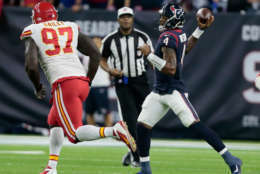 HOUSTON, TX - OCTOBER 08:  Deshaun Watson #4 of the Houston Texans passes against Allen Bailey #97 of the Kansas City Chiefs at NRG Stadium on October 8, 2017 in Houston, Texas.  (Photo by Bob Levey/Getty Images)