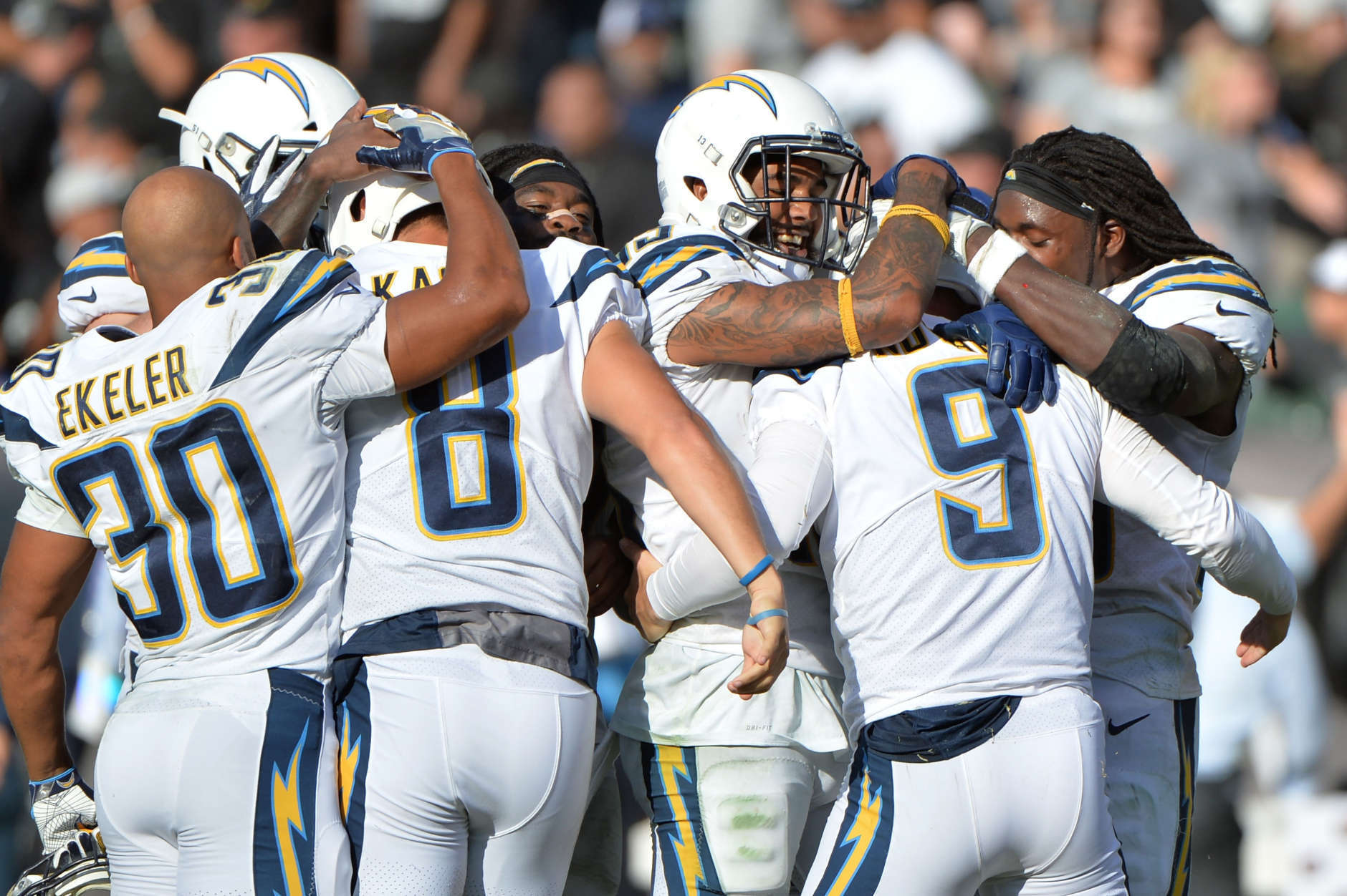 OAKLAND, CA - OCTOBER 15:  Nick Novak #9 of the Los Angeles Chargers celebrates with teammates after kicking the game winning field goal as time expires in their NFL game against the Oakland Raiders at Oakland-Alameda County Coliseum on October 15, 2017 in Oakland, California.  (Photo by Don Feria/Getty Images)