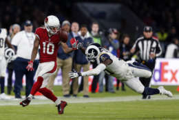 LONDON, ENGLAND - OCTOBER 22: Brittain Golden #10 of the Arizona Cardinals challenges for the ball with the Kavon Webster #21 of the Los Angeles Rams during the NFL match between the Arizona Cardinals and the Los Angeles Rams at Twickenham Stadium on October 22, 2017 in London, England. (Photo by Alan Crowhurst/Getty Images)
