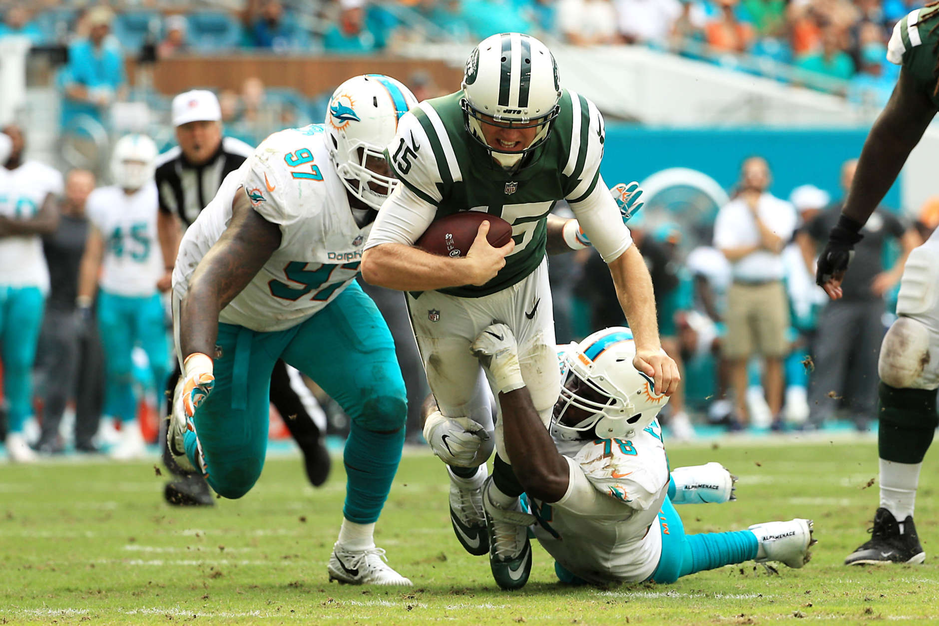 MIAMI GARDENS, FL - OCTOBER 22:  Josh McCown #15 of the New York Jets tackled by Jordan Phillips #97 and Terrence Fede #78 of the Miami Dolphins during the third quarter at Hard Rock Stadium on October 22, 2017 in Miami Gardens, Florida.  (Photo by Mike Ehrmann/Getty Images)