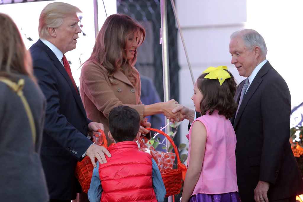 WASHINGTON, DC - OCTOBER 30:  U.S. President Donald Trump (L) and first lady Melania Trump greet Attorney General Jeff Sessions (R) and the children he was accompanying while hosting Halloween at the White House on the South Lawn October 30, 2017 in Washington, DC. The first couple gave cookies away to costumed trick-or-treaters one day before the Halloween holiday.  (Photo by Chip Somodevilla/Getty Images)