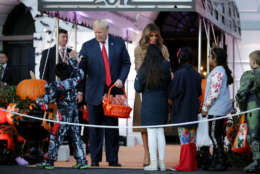 WASHINGTON, DC - OCTOBER 30:  U.S. President Donald Trump (L) and first lady Melania Trump host Halloween at the White House on the South Lawn October 30, 2017 in Washington, DC. The first couple gave cookies away to costumed trick-or-treaters one day before the Halloween holiday.  (Photo by Chip Somodevilla/Getty Images)