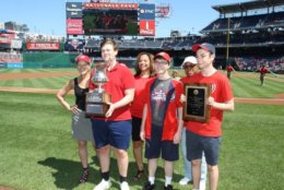 From left, Hillary Howard, Anson Berns, Montgomer Blair principal Renay Johnson, Ben Miller, Montgomery County school board member Jeannette Dixon and Ian Rackow, attend an event on Sunday, Sept. 3, 2018, honoring the winner of the 57th "It's Academic" at Nationals Park. (Courtesy Hillary Howard)