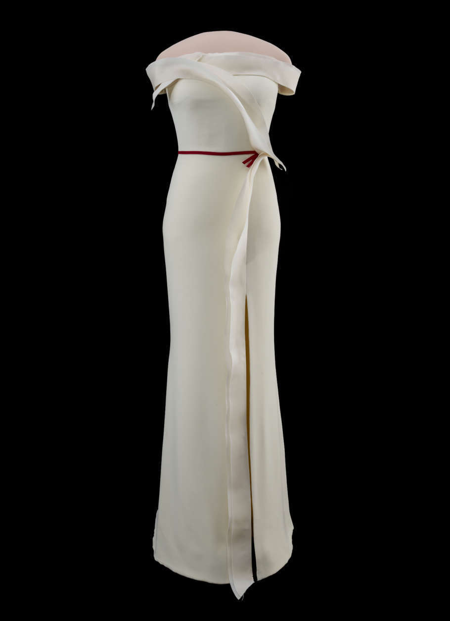 Trump collaborated with designer Hervé Pierre in creating the vanilla silk crepe dress, which features a slit skirt, ruffled accent trim and a red ribbon around the waist. (Courtesy Smithsonian's National Museum of American History)