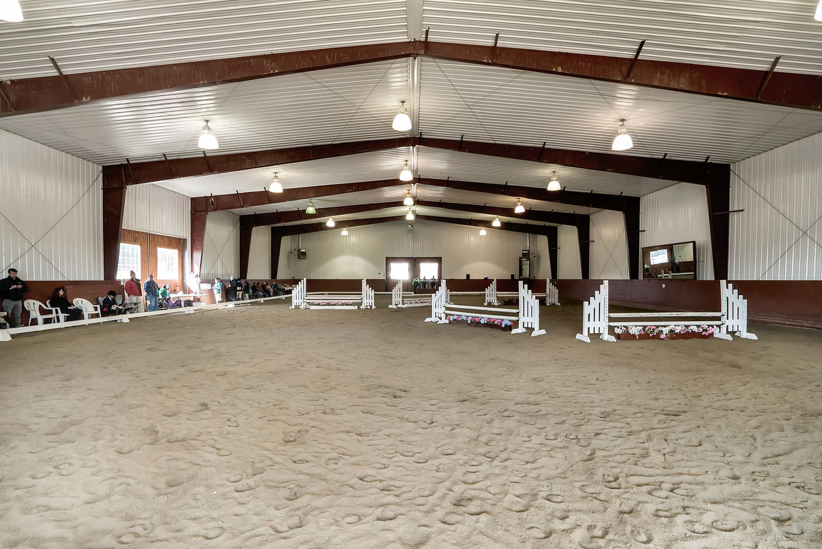 The property also includes an 11,200-square-foot indoor riding arena, two show arenas and stables and offers boarding and training. It also hosts regular events, including seven Virginia Horse Show Association Hunter/Jumper shows booked for 2017, according to the listing. (Courtesy Auction Markets LLC)