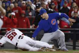 Chicago Cubs first baseman Anthony Rizzo (44) picks off Washington Nationals' Jose Lobaton on a throw from catcher Willson Contreras during the eighth inning in Game 5 of baseball's National League Division Series against the Chicago Cubs, at Nationals Park, early Friday, Oct. 13, 2017, in Washington. The Cubs challenged the call on the field and it was overturned on review. (AP Photo/Pablo Martinez Monsivais)