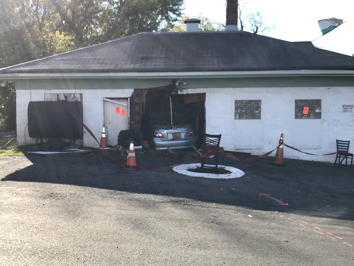 The entrance to Babes Boys Tavern @ The Top of the Hill is blocked after a car crashed into the restaurant Tuesday. (WTOP/Michelle Basch)