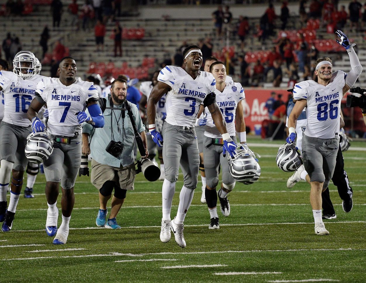 HOUSTON, TX - OCTOBER 19:  Anthony Miller #3 of the Memphis Tigers celebrates with Joey Magnifico #86 and Curtis Akins #7 after a comeback win ovewr the Houston Cougars 42-38 on October 19, 2017 in Houston, Texas.  (Photo by Bob Levey/Getty Images)