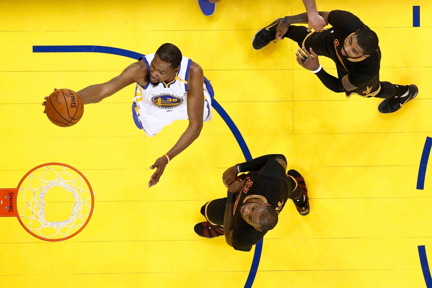 OAKLAND, CA - JUNE 12:  Kevin Durant #35 of the Golden State Warriors goes up for a shot against the Cleveland Cavaliers in Game 5 of the 2017 NBA Finals at ORACLE Arena on June 12, 2017 in Oakland, California. NOTE TO USER: User expressly acknowledges and agrees that, by downloading and or using this photograph, User is consenting to the terms and conditions of the Getty Images License Agreement.  (Photo by Monica Davey/Pool/Getty Images)