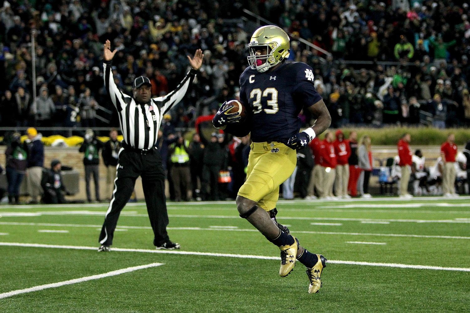SOUTH BEND, IN - OCTOBER 28: Josh Adams #33 of the Notre Dame Fighting Irish scores a touchdown in the third quarter against the North Carolina State Wolfpack at Notre Dame Stadium on October 28, 2017 in South Bend, Indiana. (Photo by Dylan Buell/Getty Images)