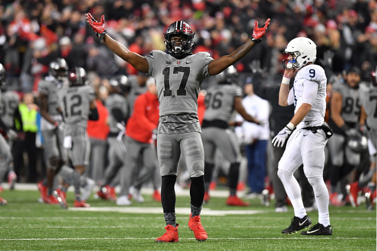 COLUMBUS, OH - OCTOBER 28:  Jerome Baker #17 of the Ohio State Buckeyes celebrates after stopping Penn State on downs in the fourth quarter as quarterback Trace McSorley #9 of the Penn State Nittany Lions walks off the field at Ohio Stadium on October 28, 2017 in Columbus, Ohio. Ohio State defeated Penn Statte 39-38.  (Photo by Jamie Sabau/Getty Images)