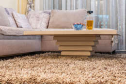 Low angle view of coffee table and white sofa