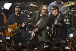 Jeff Lynne, from left, Tom Petty and Dhani Harrison perform "I Won't Back Down" at the MusiCares Person of the Year tribute honoring Tom Petty at the Los Angeles Convention Center on Friday, Feb. 10, 2017. (Photo by Chris Pizzello/Invision/AP)