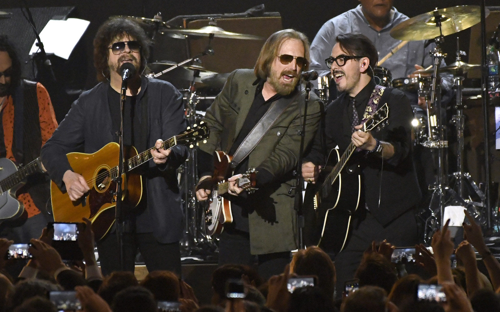 Jeff Lynne, from left, Tom Petty and Dhani Harrison perform "I Won't Back Down" at the MusiCares Person of the Year tribute honoring Tom Petty at the Los Angeles Convention Center on Friday, Feb. 10, 2017. (Photo by Chris Pizzello/Invision/AP)