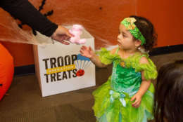 Children get a toy in exchange for 25 pieces of unwanted candy, but there is a three toy limit for kids. (Courtesy Operation Troop Treats)