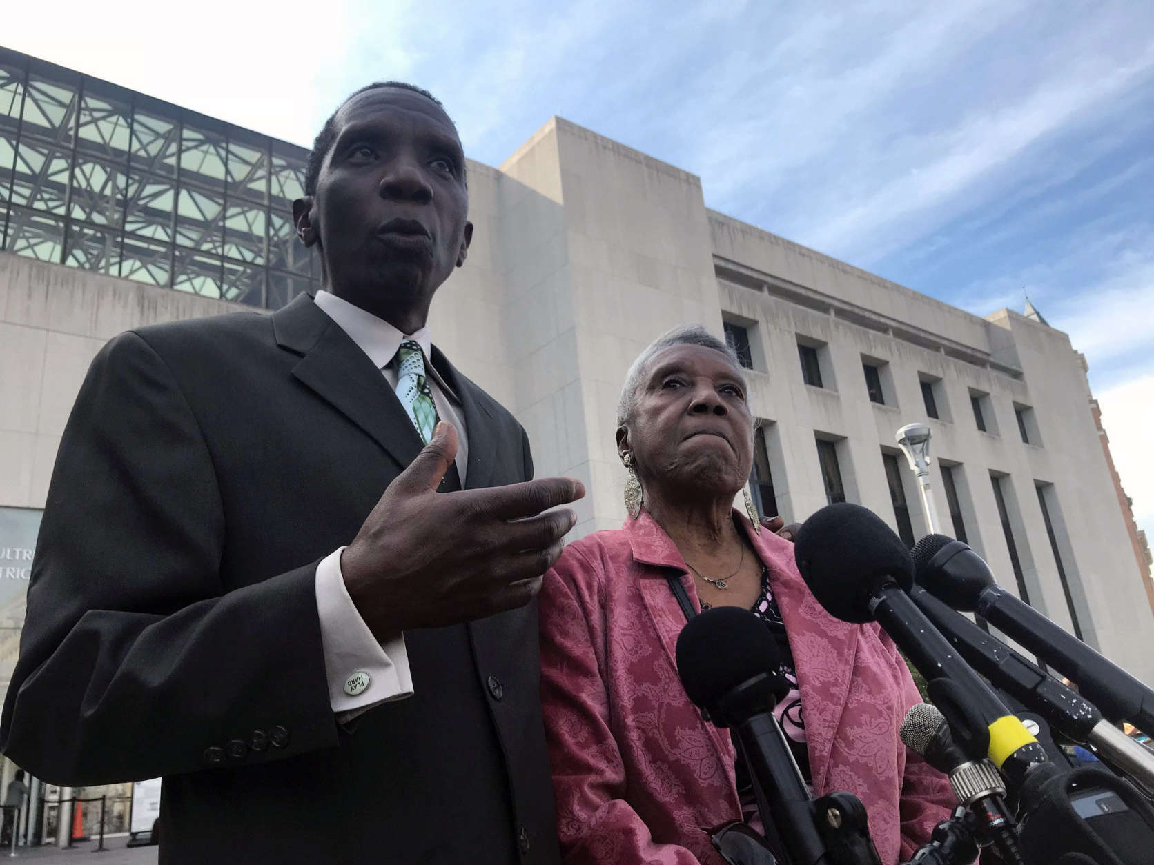 Derrick Butler and his mother Thelma Butler speak to reporters ,
 Oct. 6, after Jose Rodriguez-Cruz pleaded guilty to her murder.
 (WTOP/Neal Augenstein)