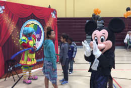 The event also featured face painting, balloons, a book giveaway and a dancing Mickey Mouse. (WTOP/John Domen)