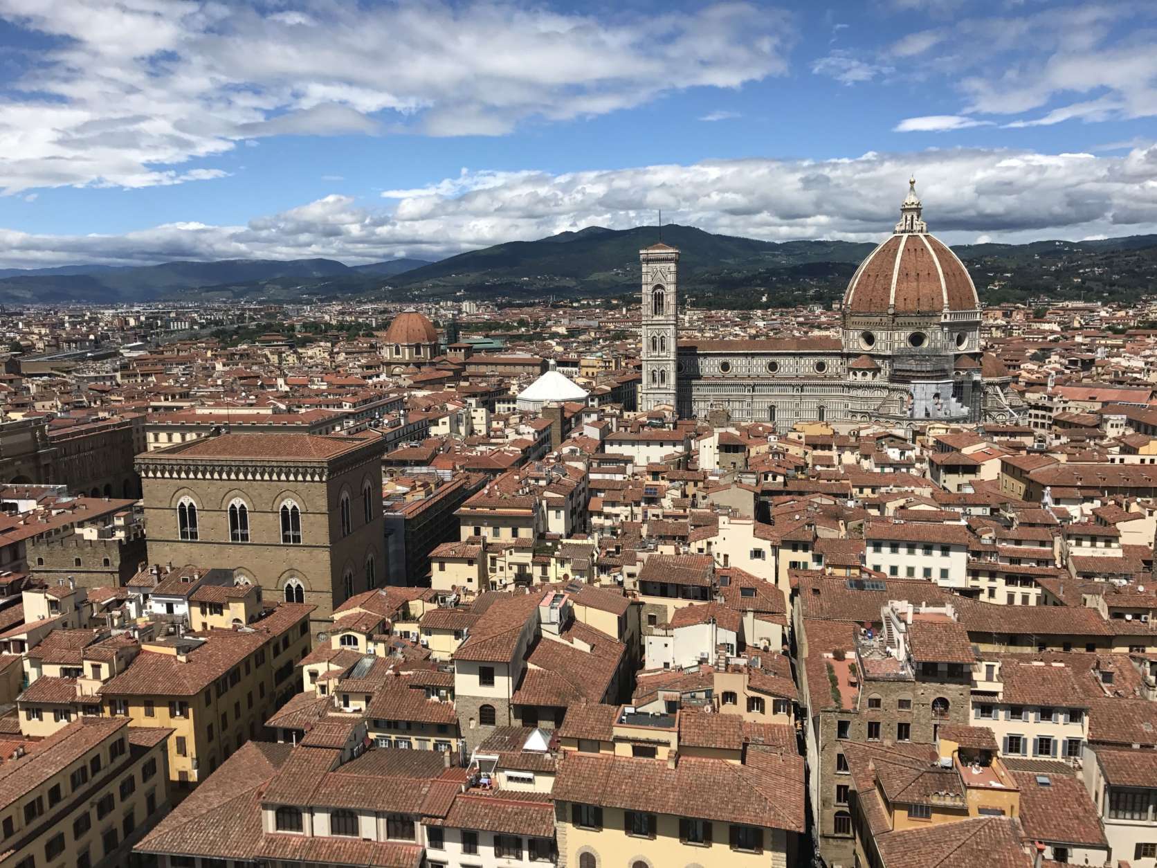 In this May 9, 2017 photo, climbing the tower of the Palazzo Vecchio in Florence, Italy, offers stunning views as seen here. Found next to the Uffizi Gallery in the famed Piazza della Signoria, the Palazzo Vecchio features a foundation of Roman ruins, palatial rooms and a replica of Michelangelo's David out front. (AP Photo/Courtney Bonnell)
