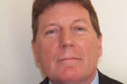 photo is a headshot of Mike Stinneford