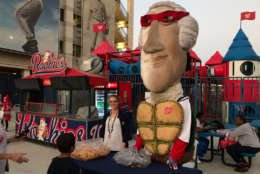 The Washington Nationals' Racing President mascot George Washington dresses as a Teenage Mutant Ninja Turtle during a Halloween-themed game, Oct. 4, 2017 at Nationals Park. (WTOP/Michelle Basch)