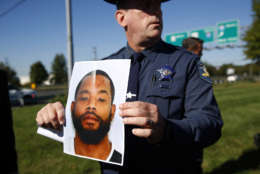 Harford County Sheriff Jeffrey Gahler displays a photo of Radee Labeeb Prince, the suspect in a shooting at a business park in the Edgewood area of Harford County, Md., Wednesday, Oct. 18, 2017. Prince killed several co-workers and wounded others before fleeing the scene, Gahler said. (AP Photo/Patrick Semansky)