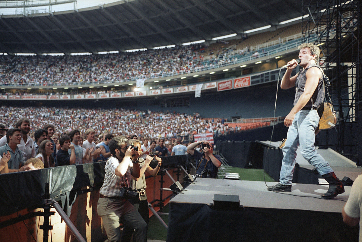Bruce Springsteen performs during his sold-out concert, Monday, August 5, 1985 at RFK Memorial Stadium in Washington, D.C.  The show is the first of a nine-week, 25-city tour of North America in support of his new album, "Born in the U.S.A." (AP Photo/Scott Stewart)