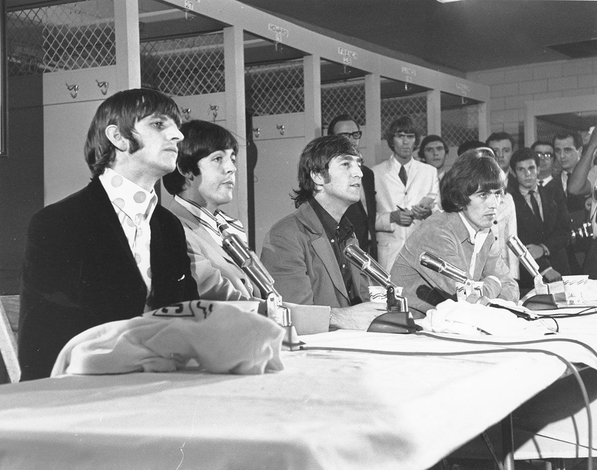 The British pop group, The Beatles, are seen holding a news conference at the District of Columbia stadium in Washington before their concert on Aug. 15, 1966.  Pictured, from left to right, are: Ringo Starr, Paul McCartney, John Lennon and George Harrison. (AP Photo/Harvey Georges)