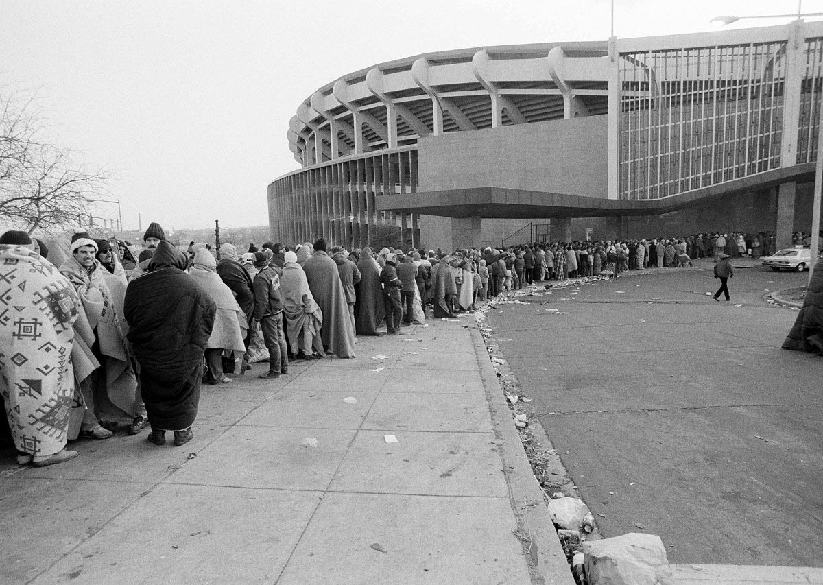 Washington Redskins fans stand in line towards RFK Memorial Stadium in Washington waiting to purchase tickets for next Saturday's NFC championship game against the winner of Sunday's Green Bay-Dallas game, Jan. 16, 1983. The fans started gathering around the stadium late Saturday night after the Redskins defeated the Minnesota Vikings 21-7 to advance to the championship game of the National Conference. (AP Photo/Ira Schwarz)