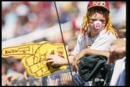 12 Sep 1993:  Fan of the Washington Redskins watches his team during a game against the Phoenix Cardinals at RFK Stadium in Washington D.C.   The Cardinals won the game 17-10. Mandatory Credit: Jed Jacobsohn  /Allsport