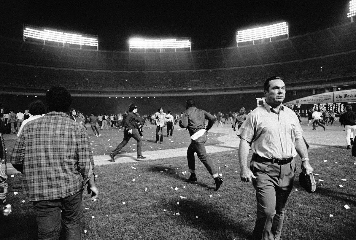 Washington Senators fans storm the field, stopping the game in the ninth inning, between the Yankees and the Senators, in Washington, Oct. 1, 1971. Fans' actions caused the Senators to forfeit the game to the Yankees. (AP Photo/Jim Palmer)