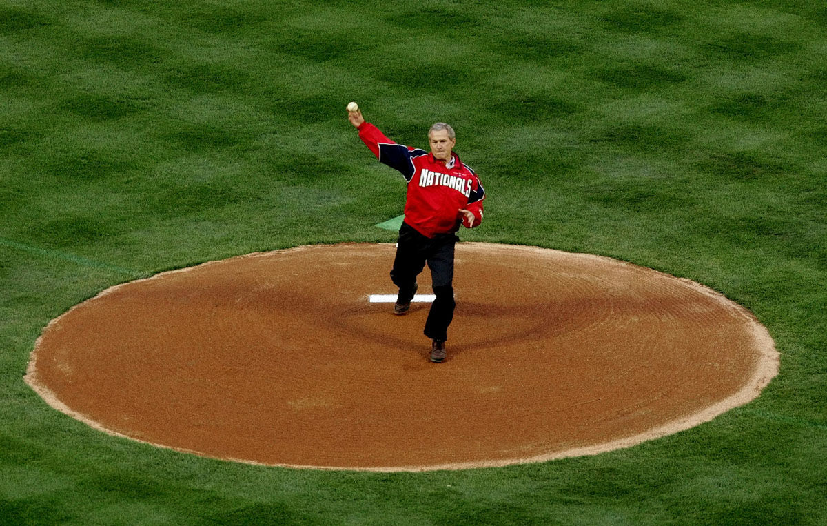 President Bush throws out the ceremonial first pitch at RFK Stadium Thursday, April 14, 2005 in Washington. Tonight's game between the Washington Nationals and the Arizona Diamondbacks is the first regular-season baseball game in the nation's capital in 34 years.  (AP Photo/Pablo Martinez Monsivais)